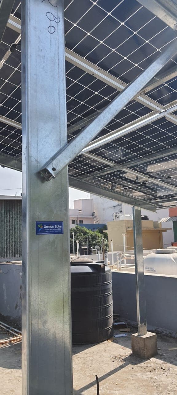 Hot-dip galvanised steel column and bracing of a raised solar structure with Genius Solar tag, Indore