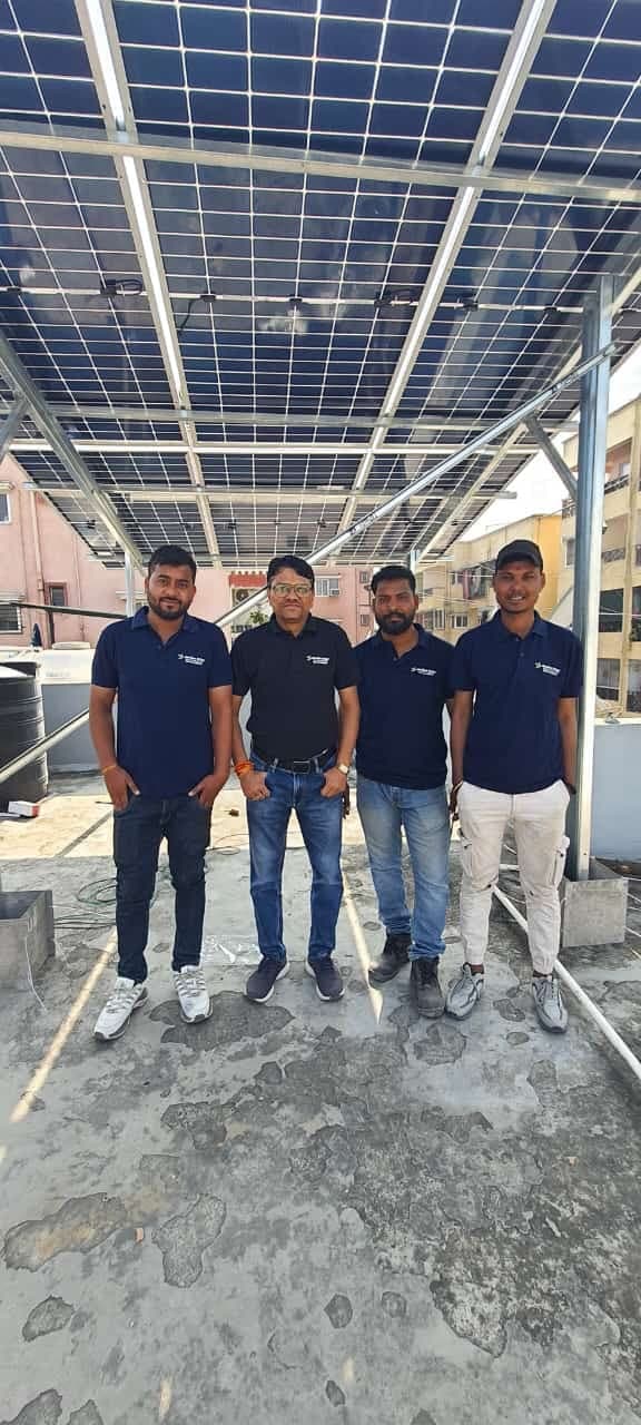 Genius Solar crew of four on a rooftop solar project in Indore